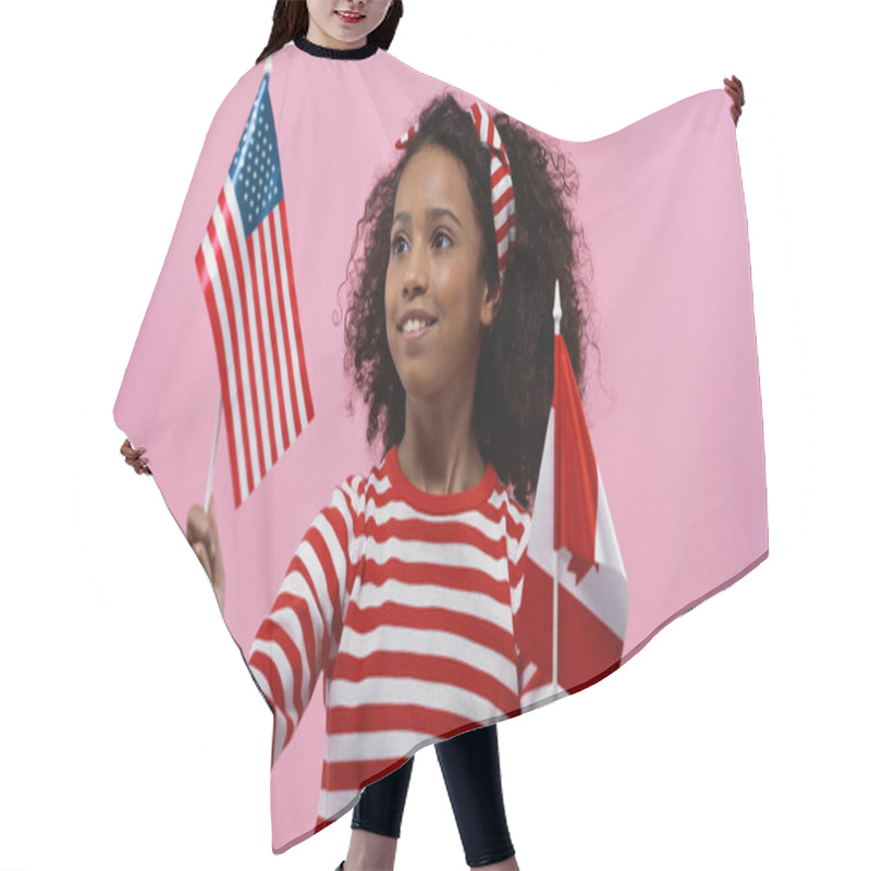 Personality  Smiling African American Girl Holding Flags Of America And Canada Isolated In Pink  Hair Cutting Cape