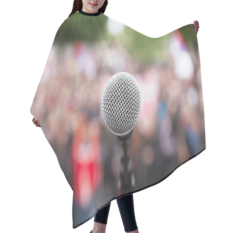 Personality  Political Protest. Public Demonstration. Microphone. Hair Cutting Cape