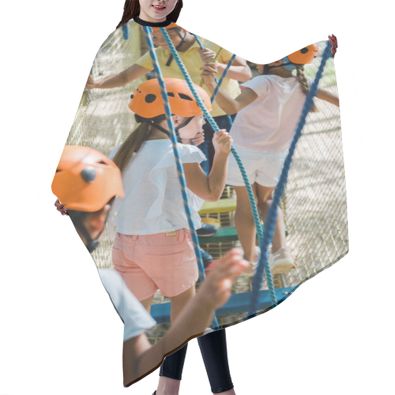 Personality  Selective Focus Of Multicultural Children Climbing Outside  Hair Cutting Cape