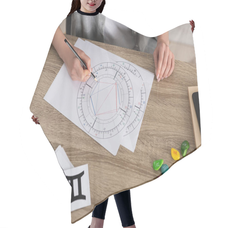 Personality  Cropped View Of Woman Drawing Natal Chart By Stones And Papers With Zodiac Signs On Table Hair Cutting Cape