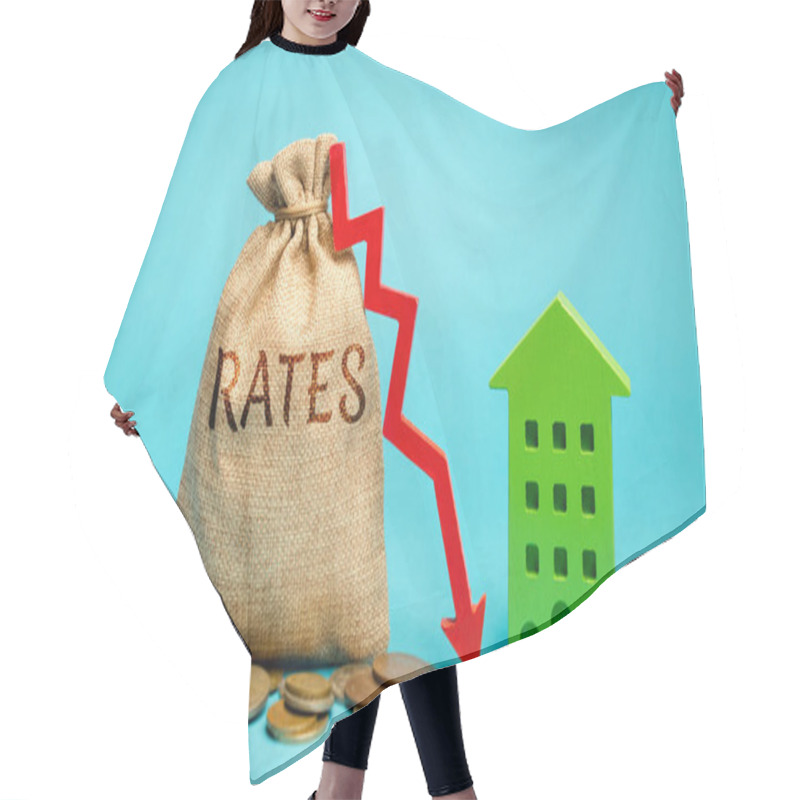 Personality  Money Bag With The Word Rates, Down Arrow And Wooden House. The Concept Of Reducing Interest Rates On Mortgages. Low Rental Rate For Housing. Real Estate Market And Loan. Hair Cutting Cape