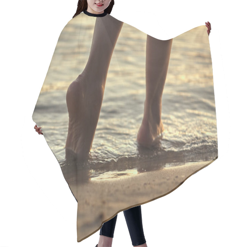 Personality  Female Feet Barefoot On A Sandy Beach In The Water. Close-up Of Beautiful Female Legs. Wet Foot. Hair Cutting Cape