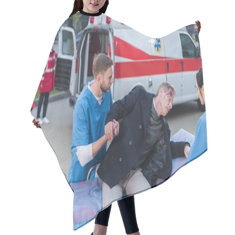 Personality  Young Paramedics Helping Injured Man Lie Down On Ambulance Stretcher Hair Cutting Cape