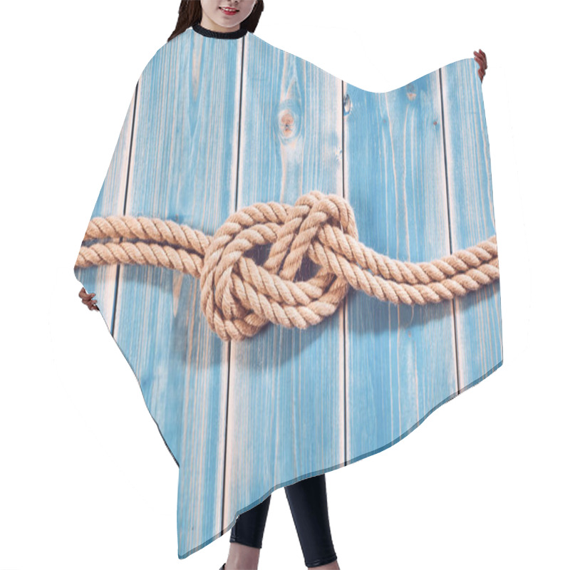 Personality  Nautical Themed Background - High Angle Still Life Of Double Figure Eight Knot In Natural Rope Across Blue Painted Wood Plank Background With Copy Space Hair Cutting Cape