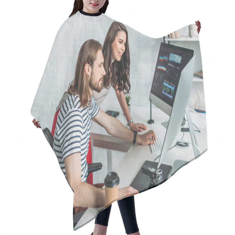 Personality  Happy Art Editor Looking At Computer Monitor Near Coworker  Hair Cutting Cape