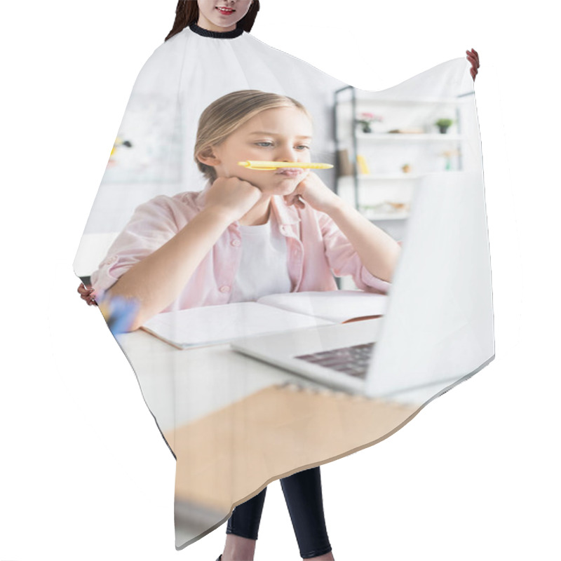 Personality  Selective Focus Of Kid Holding Pen Near Lips During Electronic Learning At Home  Hair Cutting Cape