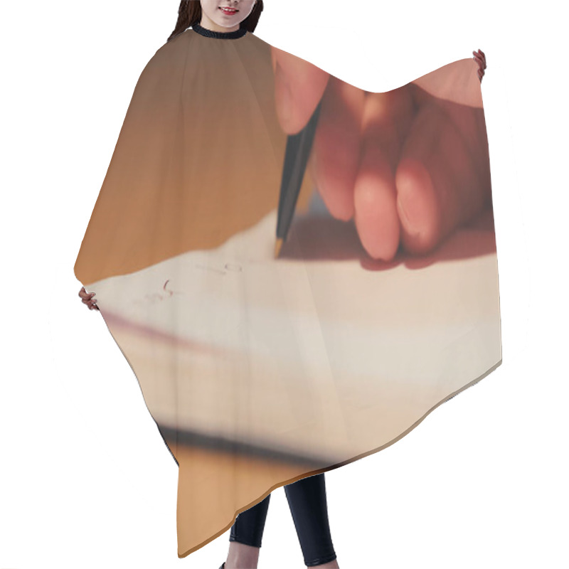 Personality  Cropped View Of Man Holding Pen While Writing On Notepad   Hair Cutting Cape