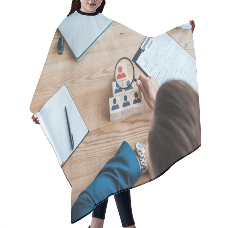 Personality  Selective Focus Of Recruiter Holding Magnifying Glass Near Wooden Cubes  Hair Cutting Cape