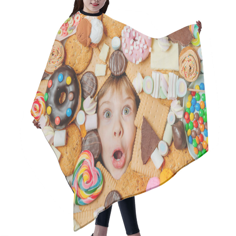 Personality  Funny 5 Years Old Girl Lying Under Plenty Of Sweet Foods. Kids Face Surrounded By Unhealthy Food. Top View, Flat Lay. Hair Cutting Cape