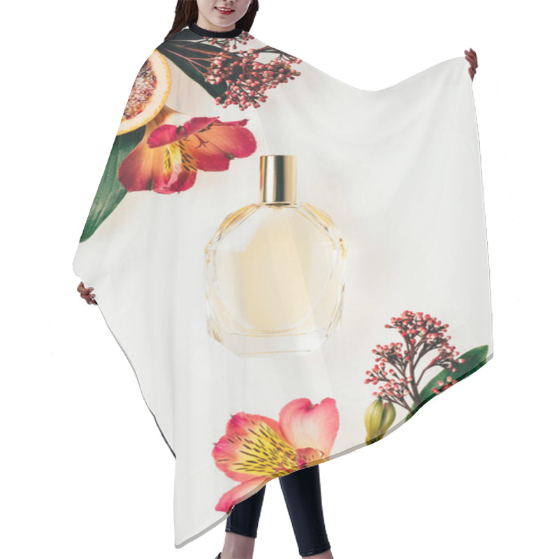 Personality  Top View Of Glass Bottle Of Aromatic Perfume With Various Flowers And Grapefruit Slices Isolated On White Hair Cutting Cape