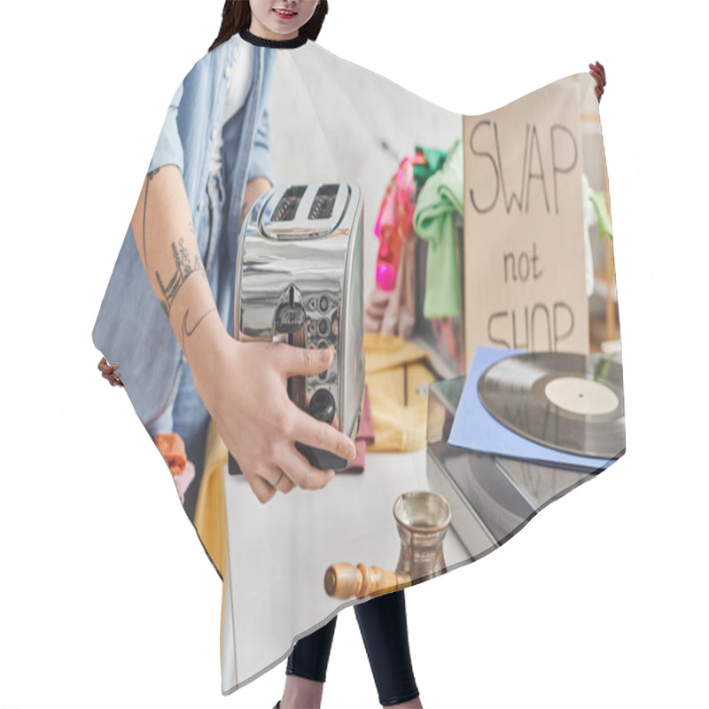 Personality  Partial View Of Young And Tattooed Woman Holding Electric Toaster Near Vinyl Record Player, Cezve And Second-hand Clothes During Swap Not Shop Event, Sustainable Living And Circular Economy Concept Hair Cutting Cape