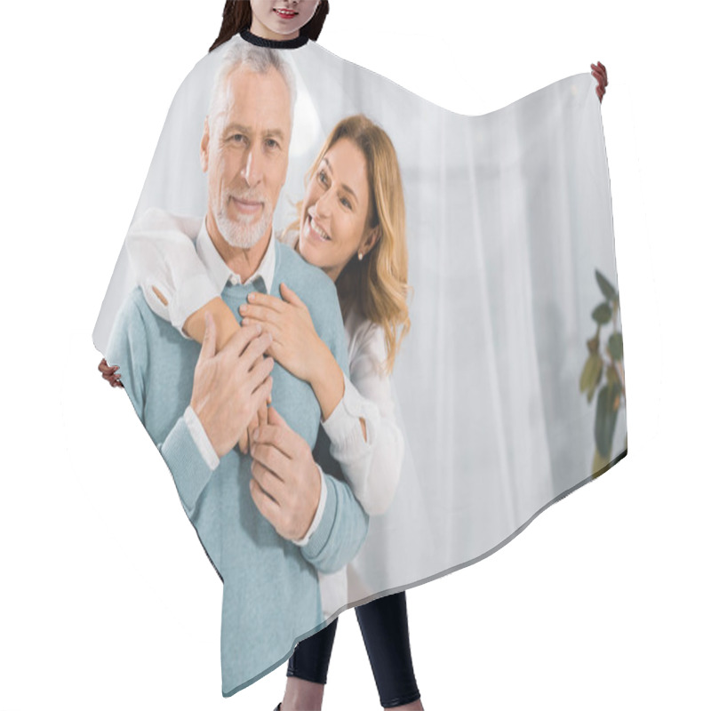 Personality  Happy Wife Embracing Mature Husband From Behind At Home Hair Cutting Cape