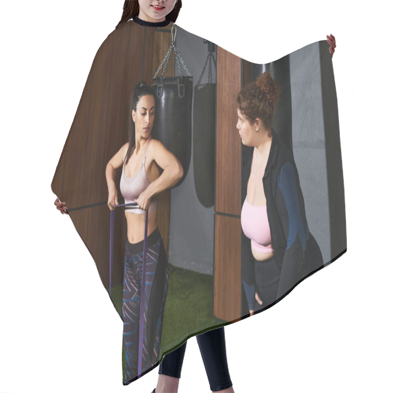 Personality  Two Women Focus On Their Resistance Band Workout In A Contemporary Fitness Center. Hair Cutting Cape