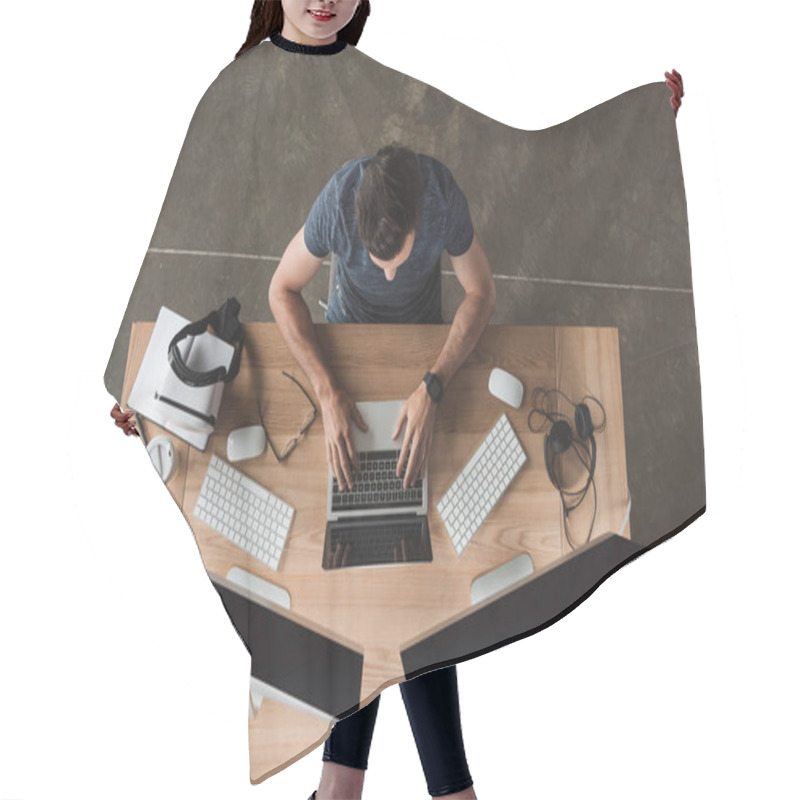 Personality  Overhead View Of Young Programmer Using Laptop And Desktop Computers At Workplace  Hair Cutting Cape