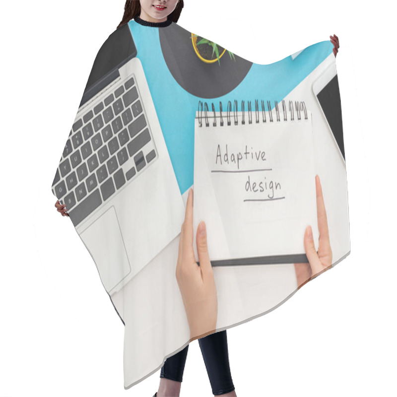 Personality  Cropped View Of Woman Holding Notebook With Adaptive Design Lettering Near Laptop, Smartphone, Plant On Abstract Geometric Background Hair Cutting Cape