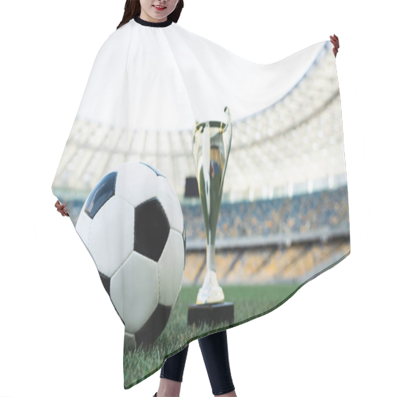 Personality  Soccer Ball And Trophy On Grassy Football Pitch At Stadium Hair Cutting Cape