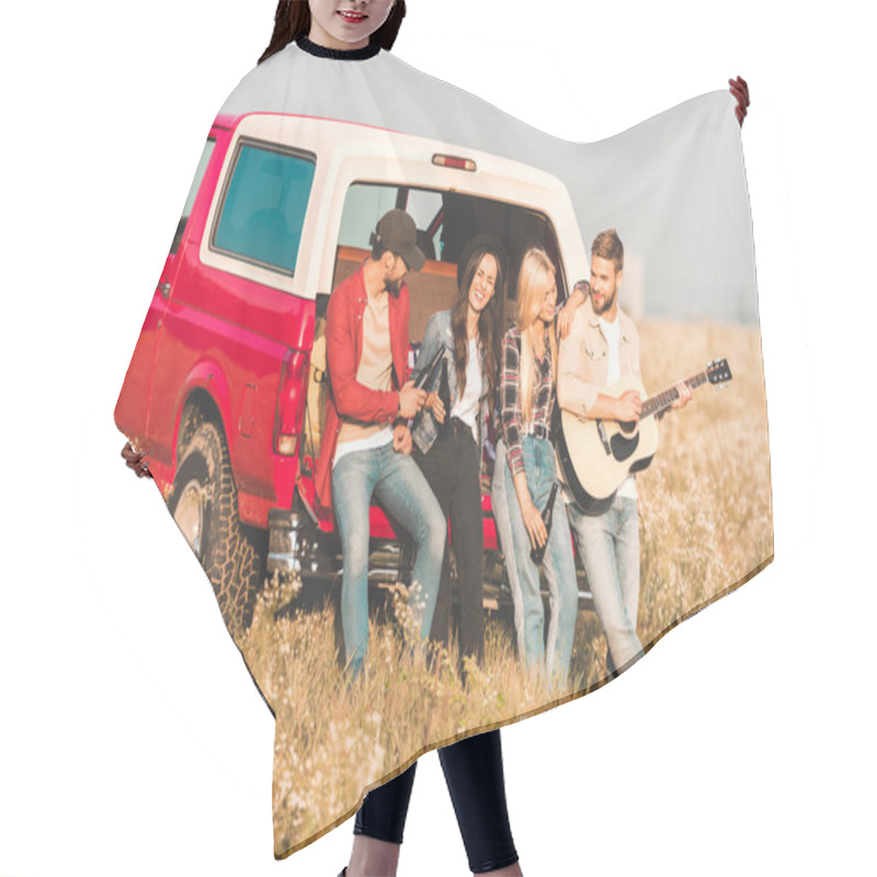 Personality  Group Of Happy Young People Drinking Beer And Playing Guitar While Relaxing In Car Trunk In Flower Field Hair Cutting Cape