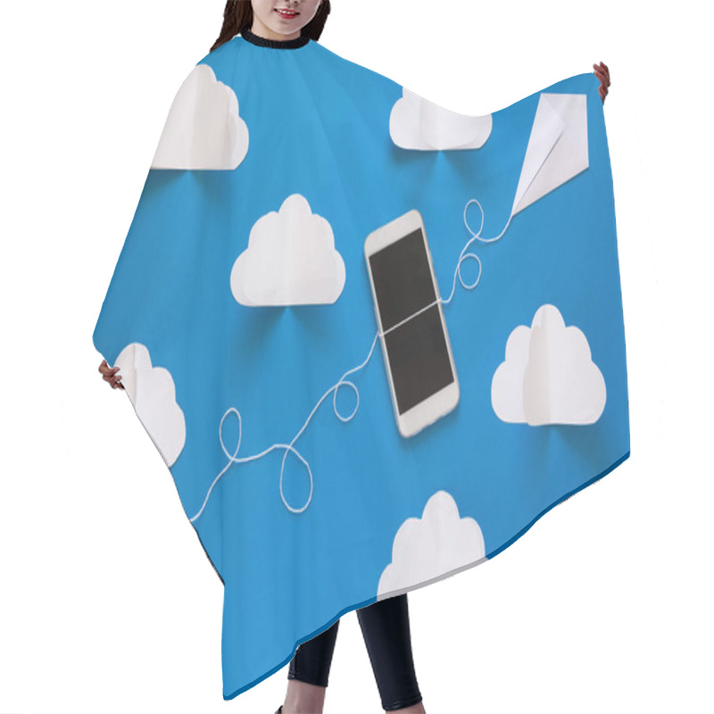 Personality  Network Connection And Cloud Storage Technology Concept. Data Communications And Cloud Computing Network Concept. Smart Phone Flying On Paper Kite On Blue Sky. Origami. Paper Cut. Top View Hair Cutting Cape