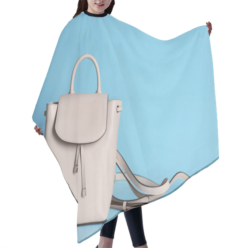 Personality  Stylish Woman's Bag On Light Blue Background Hair Cutting Cape