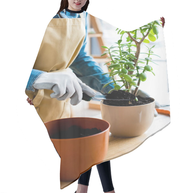 Personality  Cropped View Of Gardener In Gloves Holding Small Shovel With Ground While Transplanting Plant  Hair Cutting Cape