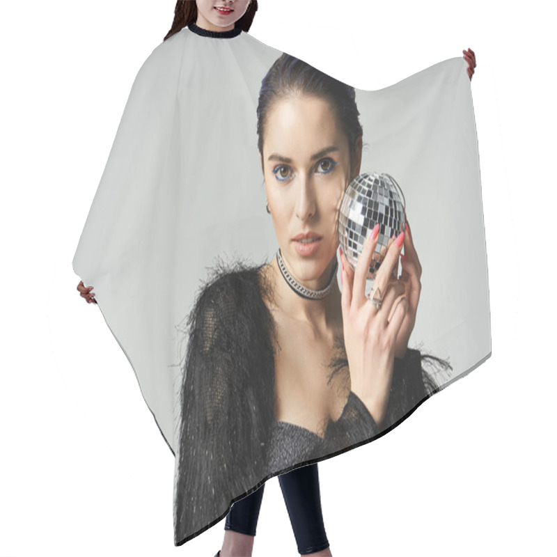 Personality  A Stylish Young Woman In A Black Dress Holding A Disco Ball, Exuding Elegance And Allure In A Studio Setting. Hair Cutting Cape