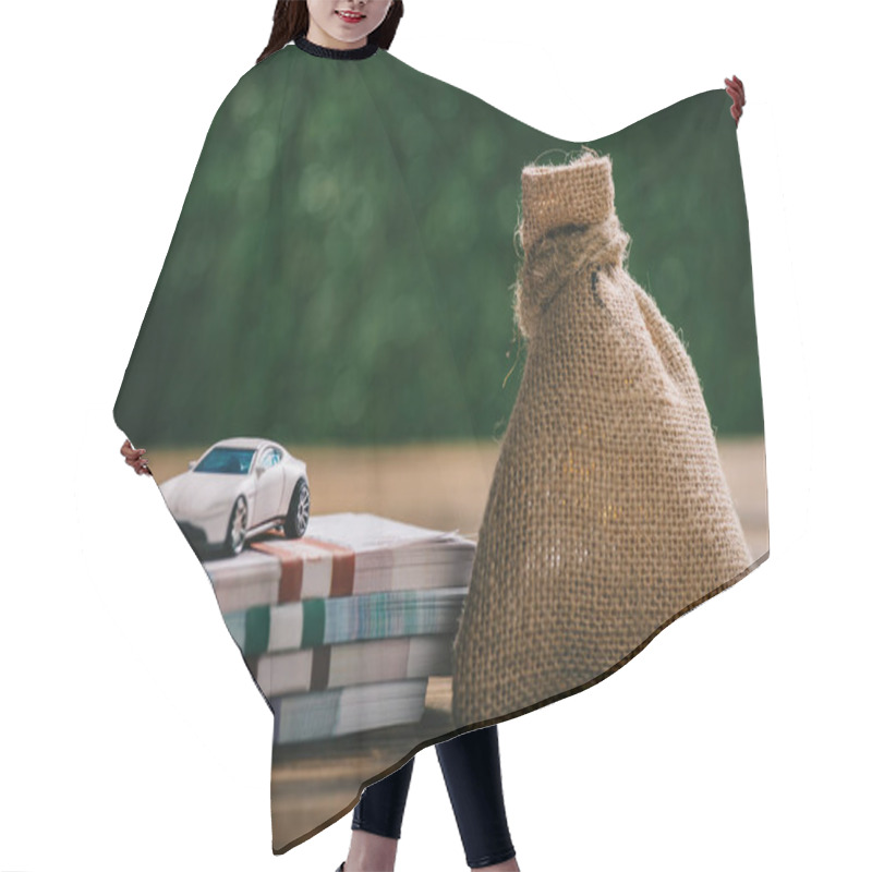 Personality  Close-up View Of Sackcloth Bag With Money, Rubles Banknotes And Model Car On Wooden Table Hair Cutting Cape