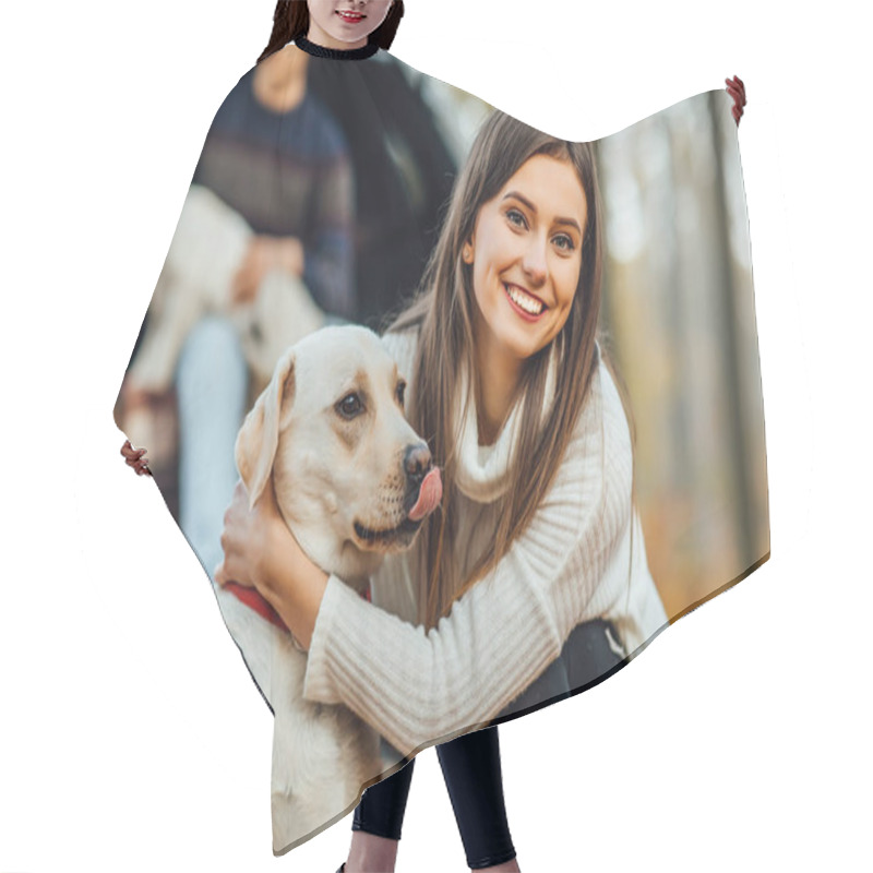 Personality  Beautiful Young Woman Hugging Her Golden Retriver Labrador In The Park. Hair Cutting Cape