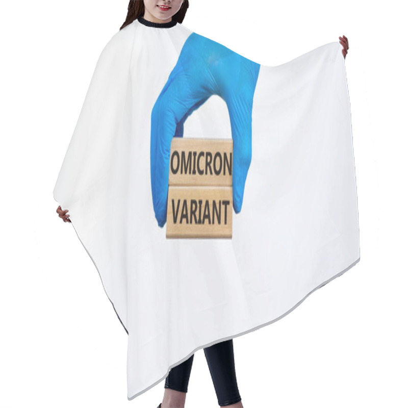 Personality  Covid-19 New Omicron Strain Symbol. Hand In Blue Glove, Wooden Blocks, Words Omicron Variant. Beautiful White Background. Copy Space. Medical And COVID-19 New Omicron Strain Variant Virus Concept. Hair Cutting Cape