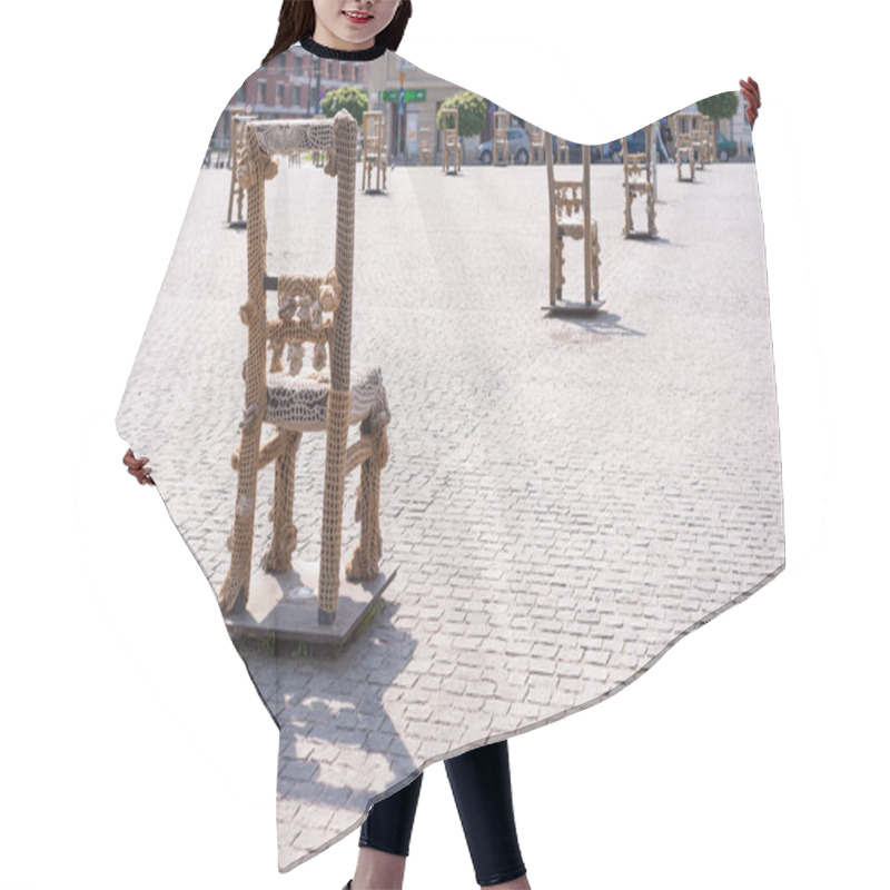 Personality  KRAKOW, POLAND - JUNE, 2017: Art Objects With Iron Chairs On Cobblestone Street Erected In Memory Of Jewish Ghetto. Krakow With Popul. Of 800,000, Has 2.35 Mill. Foreign Tourists Annually Hair Cutting Cape