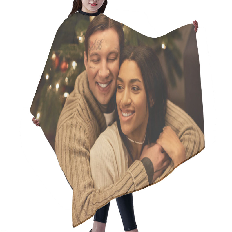 Personality  A Couple Hugs At Home, Surrounded By A Glowing Christmas Tree And Festive Decor. Hair Cutting Cape