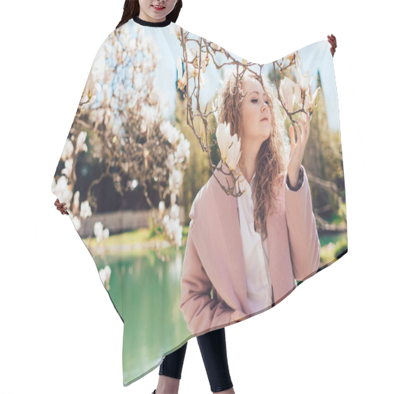 Personality  Attractive Young Woman In A Pink Coat Walking In The Park, Enjoying Fragrant Magnolia, Spring Nature Hair Cutting Cape