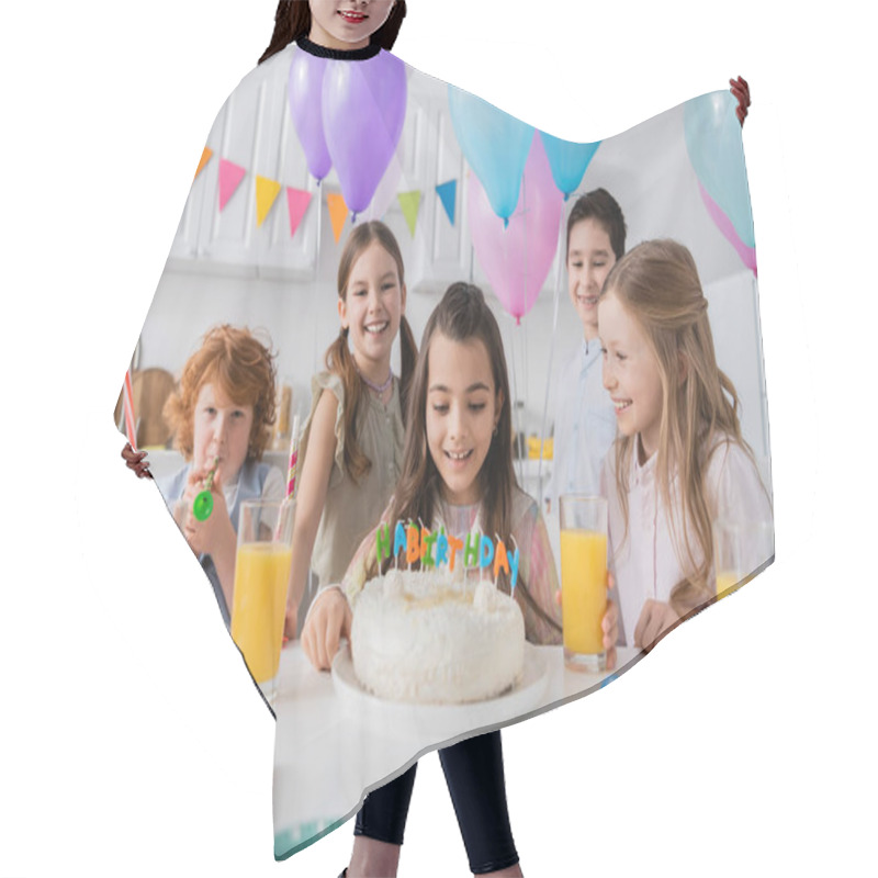 Personality  Cheerful Girl Looking At Birthday Cake Near Happy Group Of Friends During Party At Home   Hair Cutting Cape