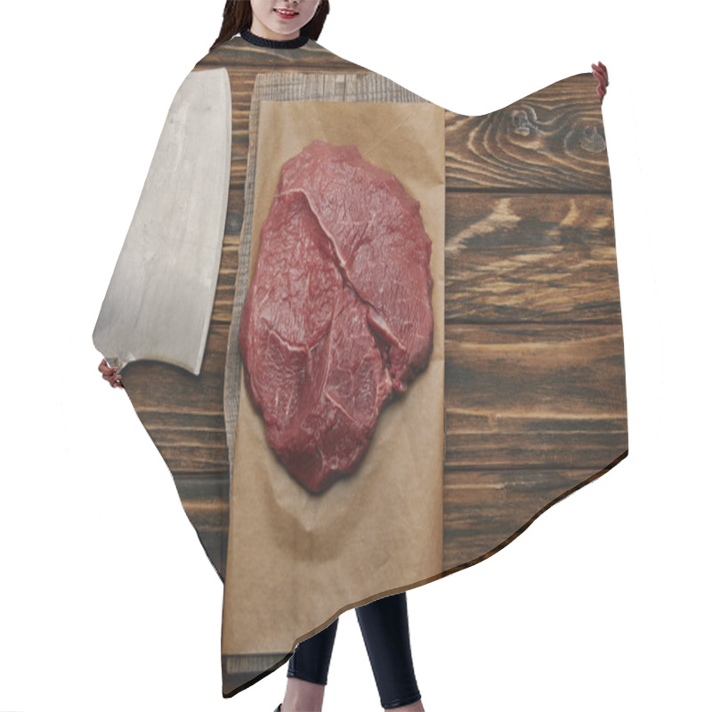 Personality  Top View Of Raw Meat On Baking Paper With Butcher Knife On Wooden Background Hair Cutting Cape