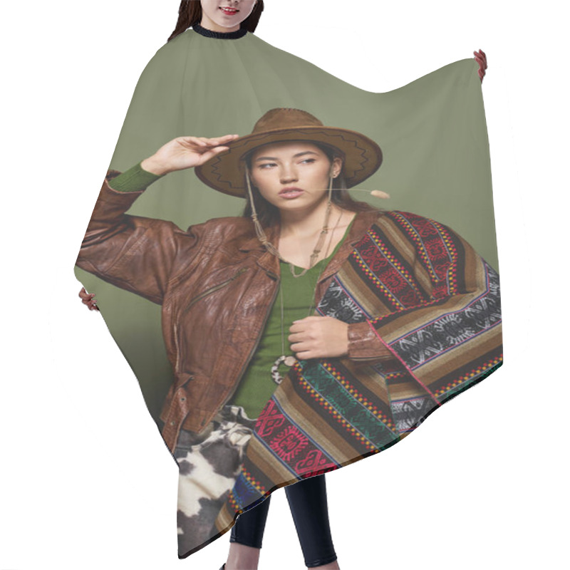 Personality  Brunette Woman Poses Confidently, Wearing Striking Traditional Garments And A Stylish Hat. Hair Cutting Cape