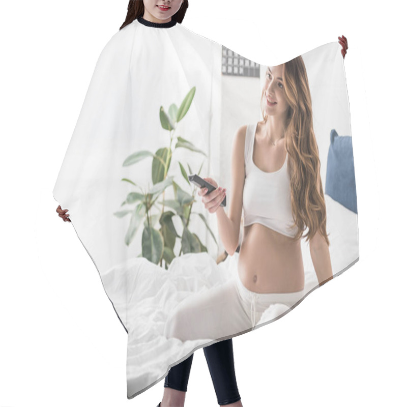 Personality  Smiling Pregnant Girl Sitting On Bed And Holding Tv Remote Control Hair Cutting Cape