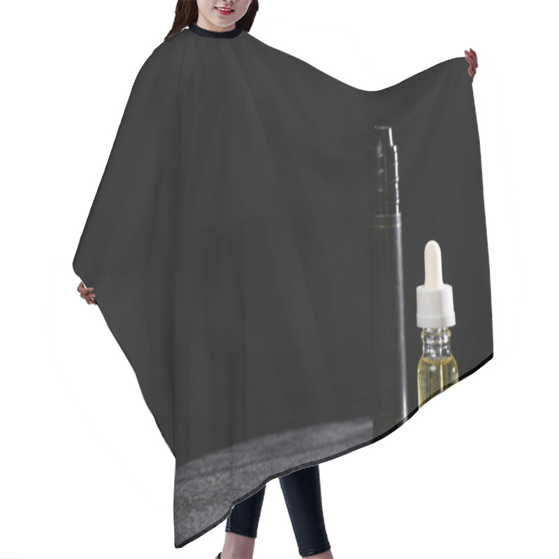 Personality  Electronic Cigarette And Liquid Isolated On Black Hair Cutting Cape