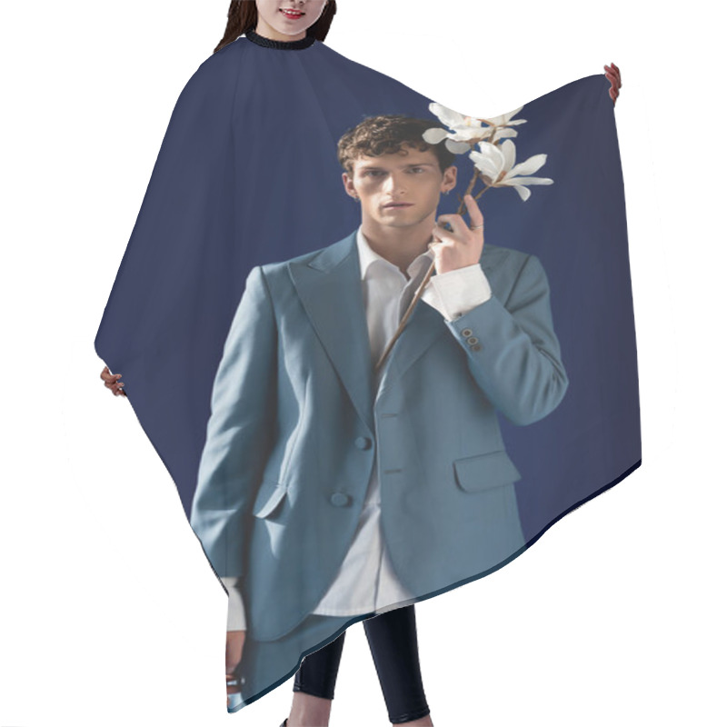 Personality  Trendy Young Man In Suit Holding Branch Of Magnolia Isolated On Navy Blue  Hair Cutting Cape