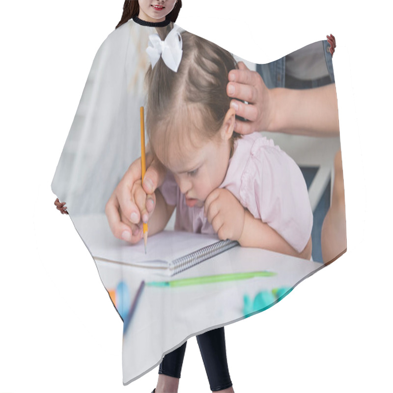 Personality  Teacher Assisting Disabled Girl With Down Syndrome Drawing Near Blurred Child In Private Kindergarten  Hair Cutting Cape