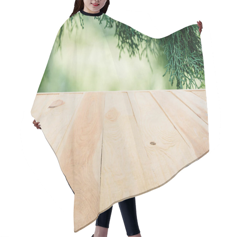 Personality  Template Of Beige Wooden Floor Made Of Planks On Blurred Green Background With Pine Tree Leaves Hair Cutting Cape