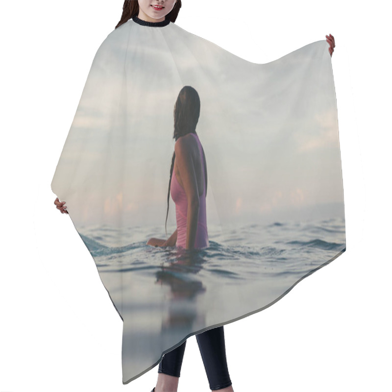 Personality  Silhouette Of Female Surfer Sitting On Surfboard In Water At Sunset Hair Cutting Cape