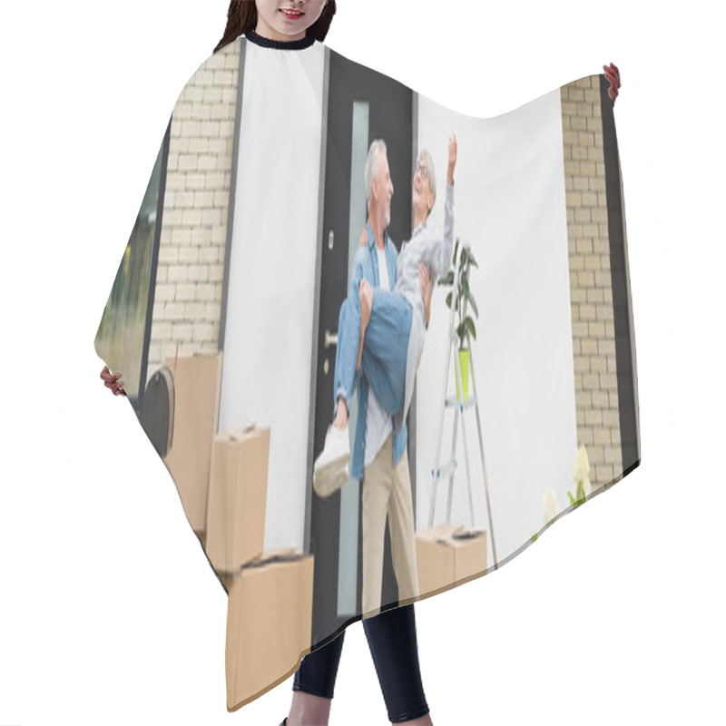 Personality  Panoramic Shot Of Mature Man Holding Smiling Woman Near New House  Hair Cutting Cape