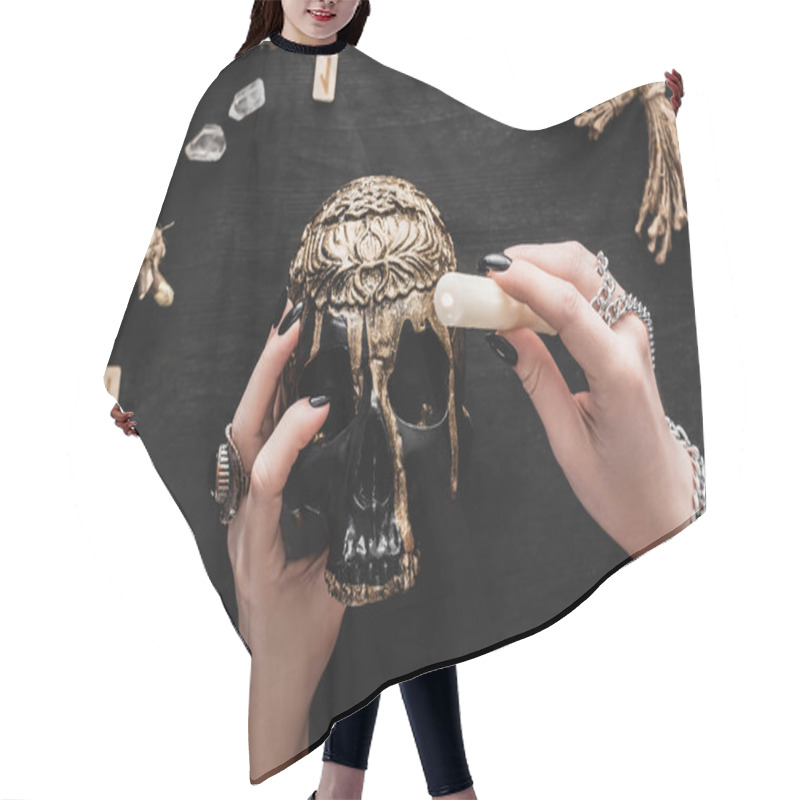 Personality  Cropped View Of Woman Holding Candle Above Skull Near Runes And Crystals On Black  Hair Cutting Cape