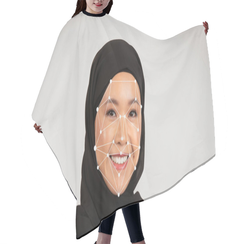 Personality  A Cheerful Asian Woman Wearing A Black Hijab Poses Confidently, Showcasing A Facial Recognition Technology Overlay Highlighting Facial Features In A Studio Setting. Hair Cutting Cape