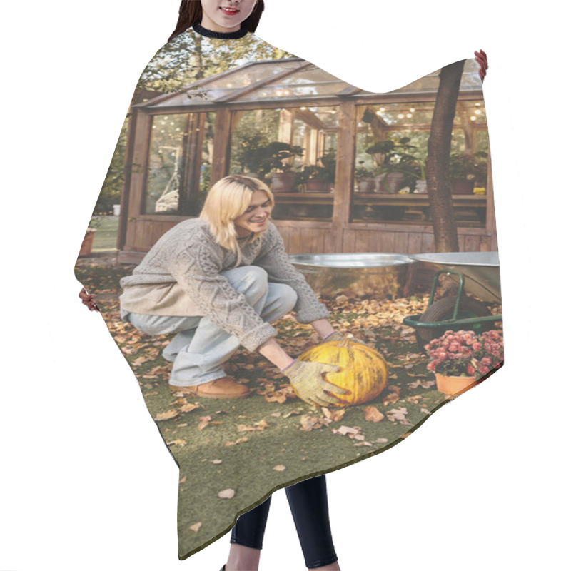 Personality  A Young, Handsome Man With Blonde Hair Happily Tends To A Pumpkin In A Lush Garden Filled With Autumn Leaves. Hair Cutting Cape