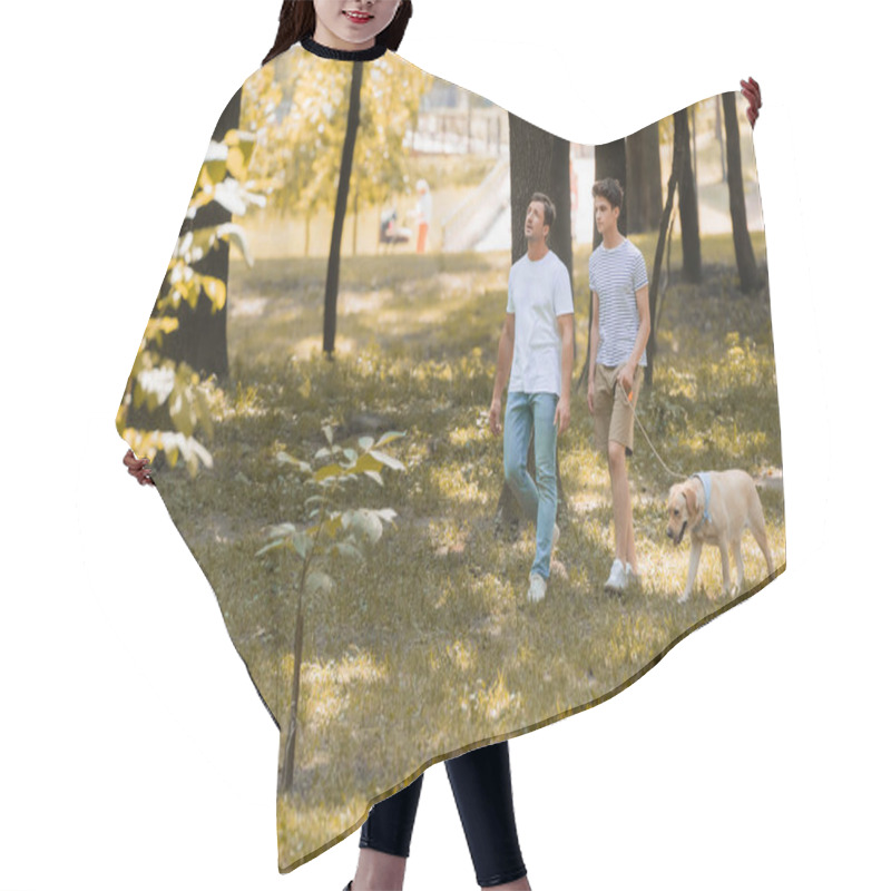 Personality  Man Looking Up Near Teenager Son Walking In Park With Golden Retriever  Hair Cutting Cape