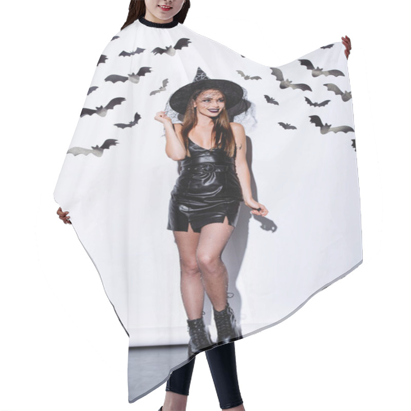 Personality  Girl In Black Witch Halloween Costume Near White Wall With Decorative Bats Hair Cutting Cape