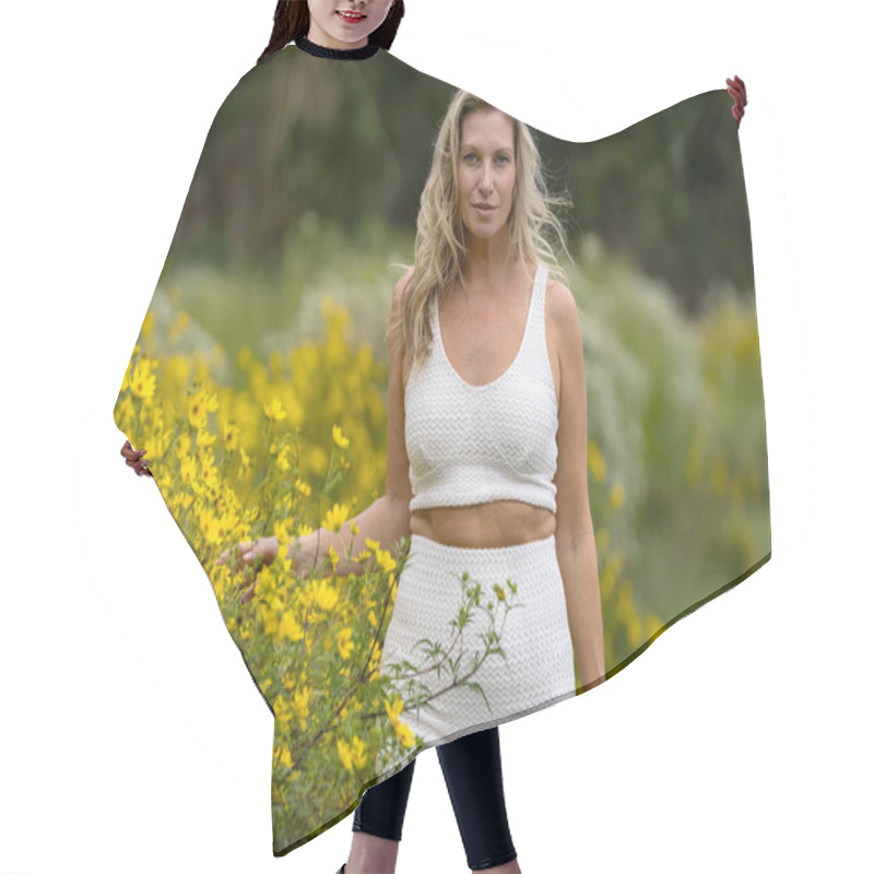 Personality  A Beautiful Blonde Model Strolls Through A Field Of Vibrant Yellow Flowers, Striking Poses For Portraits. The Late Summer Sun Casts A Warm Glow Over The Scene, Highlighting Her Grace And Natural Beauty. Hair Cutting Cape