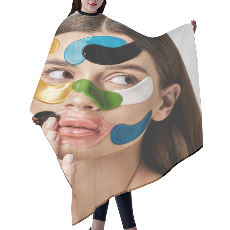 Personality  A Young Woman With Eye Patches On Her Face Holds Her Hand Up, Showcasing Bold Makeup And Artistic Expression. Hair Cutting Cape