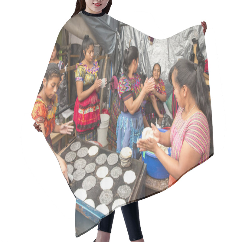 Personality  Chichicastenango, Guatemala, 27th February 2020: Mayan Ladies At Traditional Market Making Tortillas Hair Cutting Cape