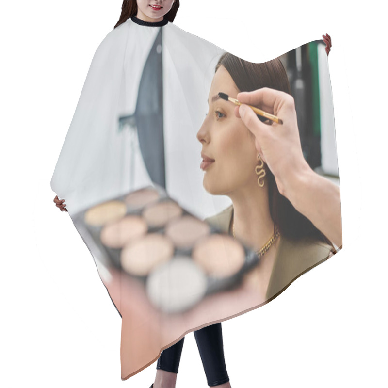 Personality  A Woman Receiving A Makeup Application From A Talented Artist. Hair Cutting Cape